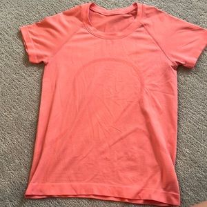 pinky/orange lulu swiftly tech racelength size 4
